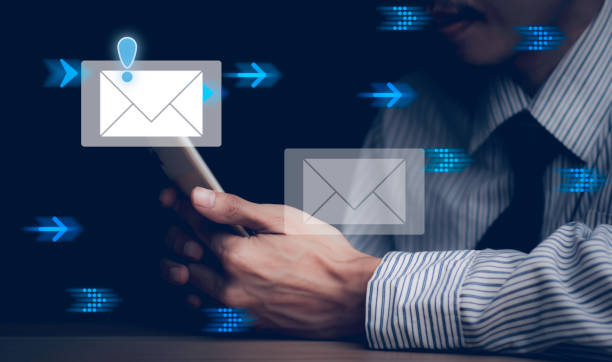 istock Businessman touching smartphone with open e-mail, receiving business e-mail news alerts Advertising by sending and customer messaging. online digital technology direct selling business, reminder. 1460240554