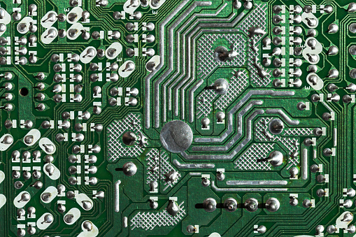 Printed circuit board background, micro electronics component, front view. Macro photo