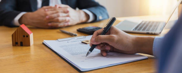 istock sign real estate and insurance contract 1460242664