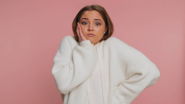 istock Confused woman feeling embarrassed about ambiguous question having doubts no idea clueless uncertain 1460243325
