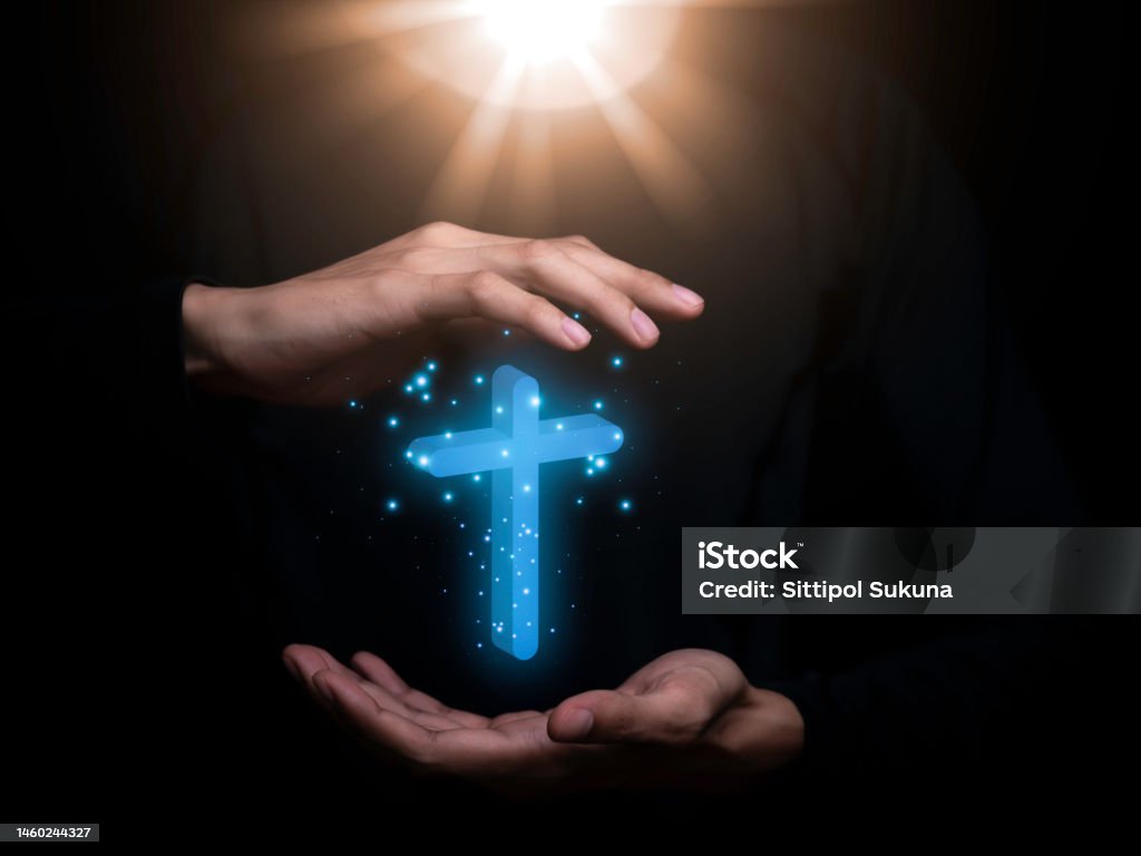 Christian holding cross hands to ask for blessing from God faith in religion And studying the Scriptures in the Bose represents hope. and love for God, crucifix,rood,Praying for Christians. Arm Stock Photo