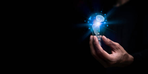 istock Businessman holding a light bulb, Creative new idea. Innovation, brainstorming, solution and inspiration concepts. imagination, creative thinking problem solving.. 1460245333