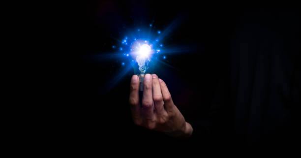 istock Businessman holding a light bulb, Creative new idea. Innovation, brainstorming, solution and inspiration concepts. imagination, creative thinking problem solving.. 1460245334