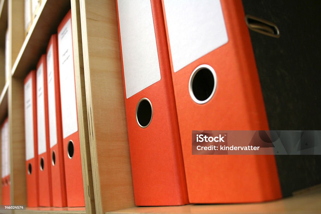 Orange folders Order is half the office life, nice when the folders are the same color. Business Stock Photo