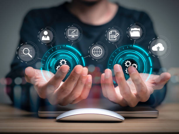 istock businessman holding icon business Analytics and Data Management System on computer, online document management and metrics connected to database. Corporate strategy for finance, operations, sales. 1460247337