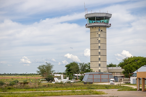 Maun International Airport, Botswana - December 19th 2022:  The control tower in the African airport in Maun seen from a leaving aircraft