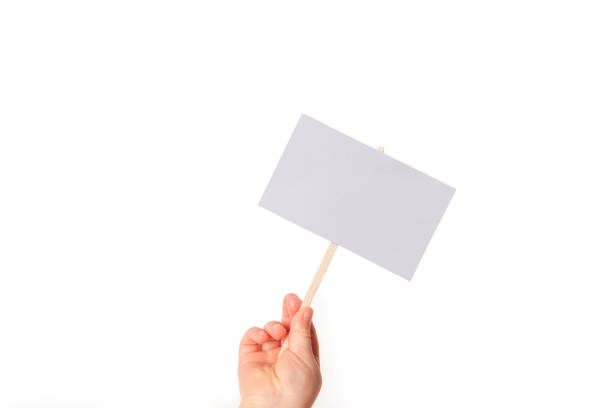 istock Child hand holding a sign 1460249015