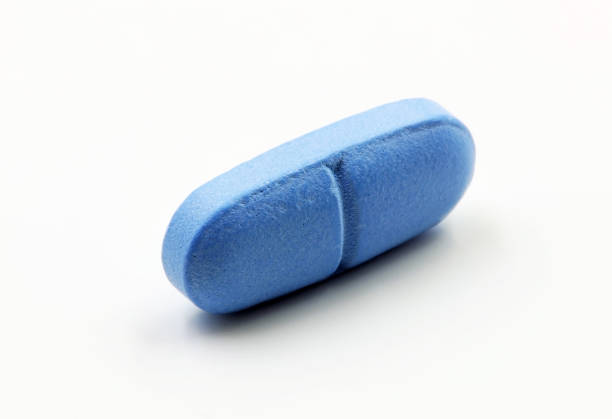 istock A blue pill or medicine on a white background 1460249368