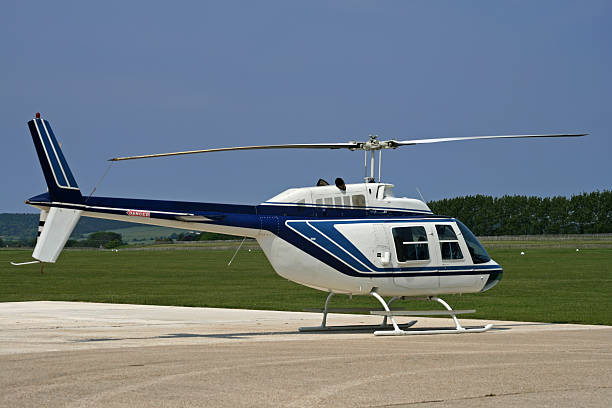 istock side of white helicopter parked at airport 146024946