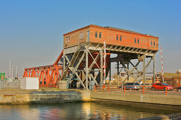This Bascule bridge at Birkenhead docks is still fully working and regularly is raised in order to let the large ships into the dock. The red paint is now peeling and rust is coming through the frame yet thousands of cars and lorries cross it without a moments thought each day.
