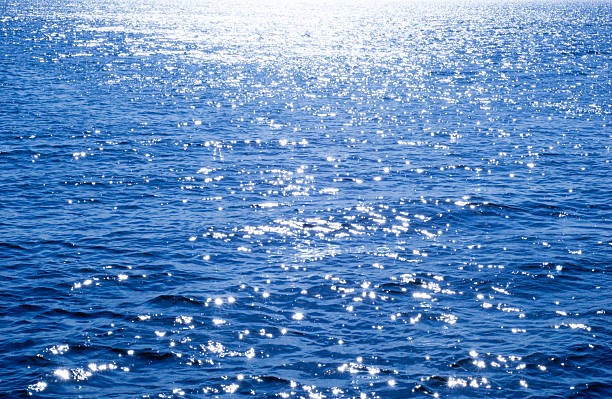 water background blue water background glittering sea stock pictures, royalty-free photos & images