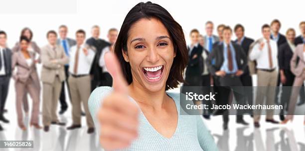 Cheerful Businesswoman Showing Thumbs Up With Colleagues Standing Behind Her Stock Photo - Download Image Now