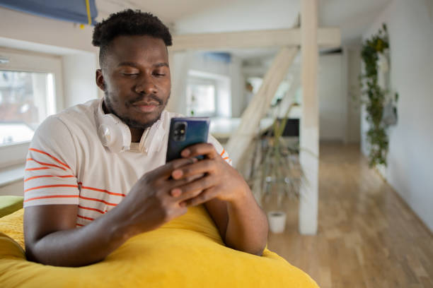 istock Portrait of a young man using smartphone 1460262299