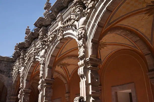 Photo of Courtyard Grey Scluptures Orange Arches Queretaro Mexico