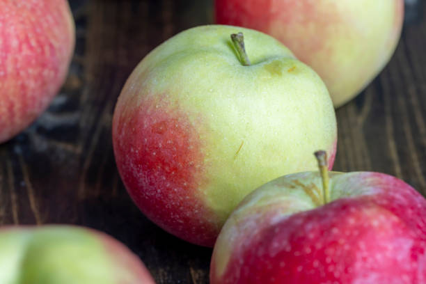 Fresh red and green apples on the kitchen table