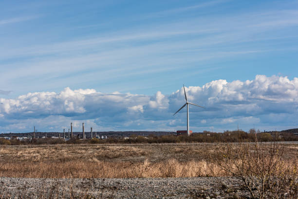 istock Wind turbine by an open field.. 1460263440