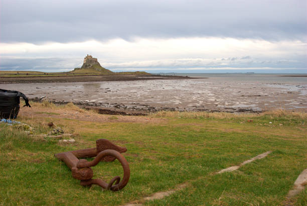 Lindisfarne castle, anchor and bay in January stock photo