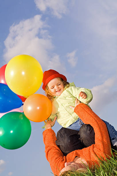istock Women and child playing with balloons 146026797