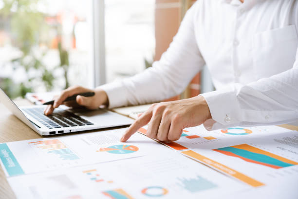 istock Businessman analyzing company growth, future business growth arrow graph, development to achieve goals, business outlook, financial data for long term investment. 1460269481