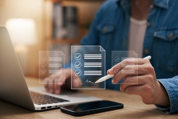 istock Electronic Signature Concept, Electronic Signing Businessman signs electronic documents on digital documents on virtual laptop screen using stylus pen. 1460269499