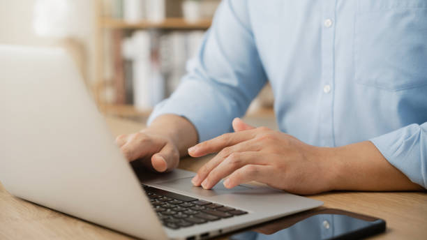 istock businessman Work using laptop computer contact us at workplaces, planning business ideas investors internet searching, ideas connecting people. 1460269563