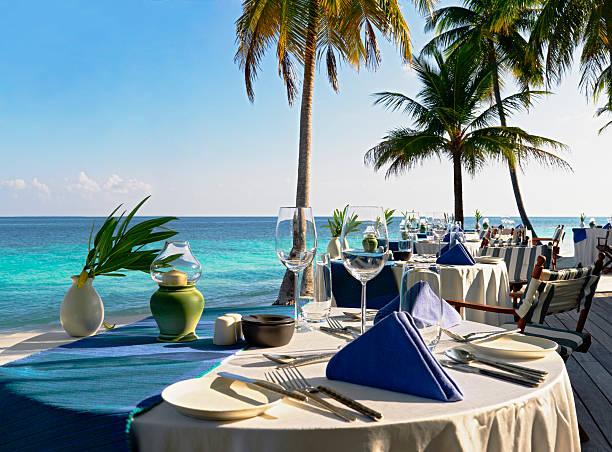 istock Open air restaurant table at beautiful blue water beach 146027161