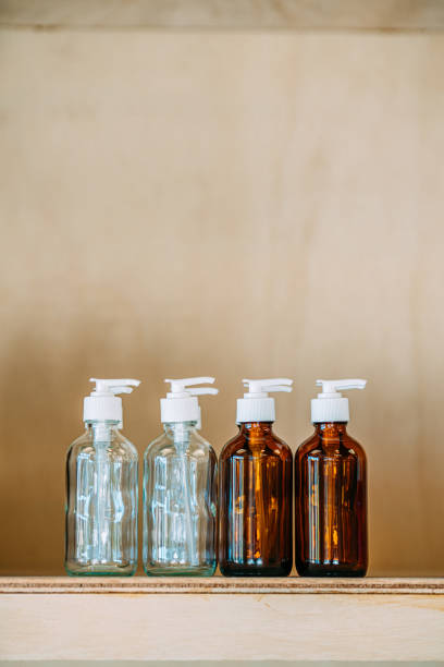 istock Mini Glass Pump-Top Bottles on Shelf for Sale at Zero Waste Store 1460272243