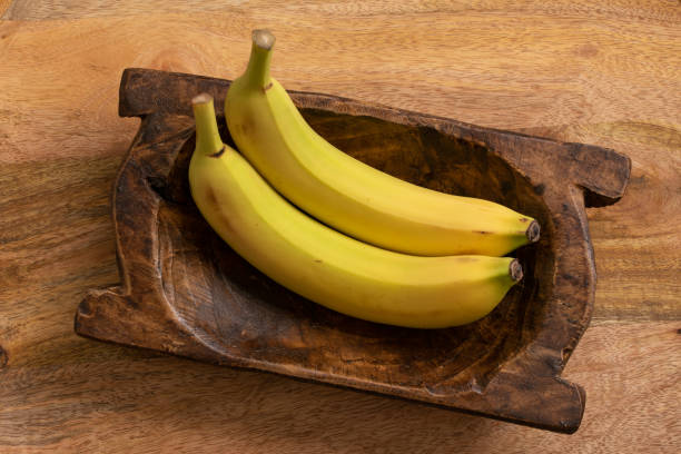istock Ripe Bananas in a Wood Bowl 1460275511