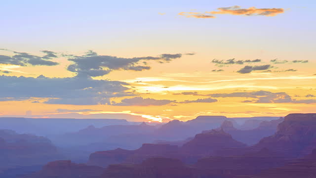 The sunset over horizon shows magic of the atmospheric effects. Grand Canyon, Arizona.
