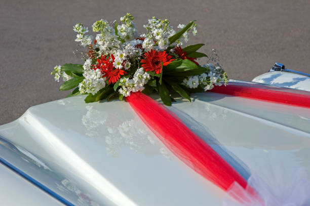 istock Floral ornaments on a white wedding car 1460279248