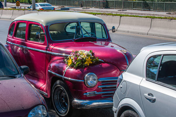 A vintage red wedding car