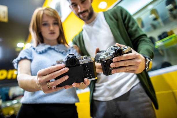 istock Young couple seen in a camera shop 1460283731
