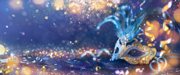 Carnival Party - Venetian Mask On Glitter Carnival - Venetian Mask Party - Masquerade Disguise With Shiny Streamers On Abstract Defocused Bokeh Lights purple and gold masquerade masks stock pictures, royalty-free photos & images