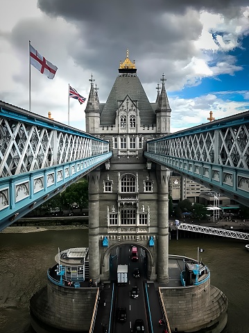 Tower Bridge in open position  to allow passage of ships and boats. Historic bridge across the River Thames in London, England