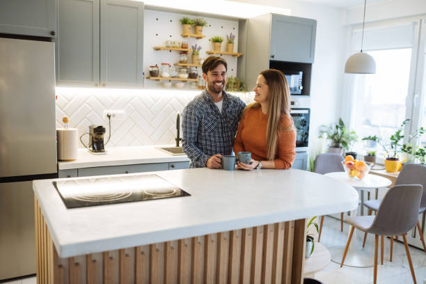 istock Couple at home enjoying coffee in kitchen 1460287196