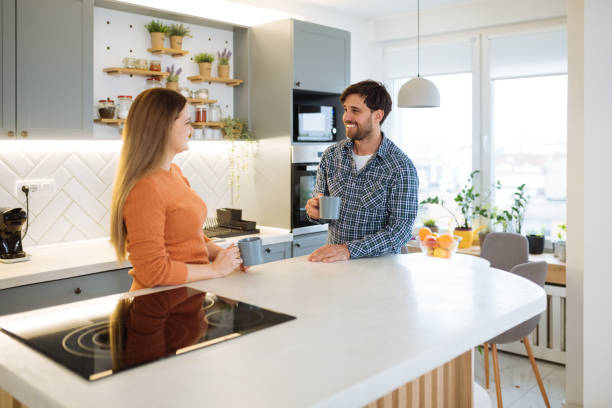 istock Couple at home enjoying coffee in kitchen 1460287201