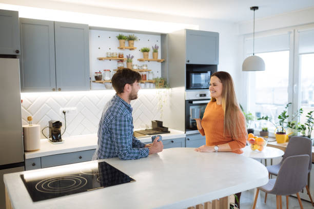 istock Couple at home enjoying coffee in kitchen 1460287206
