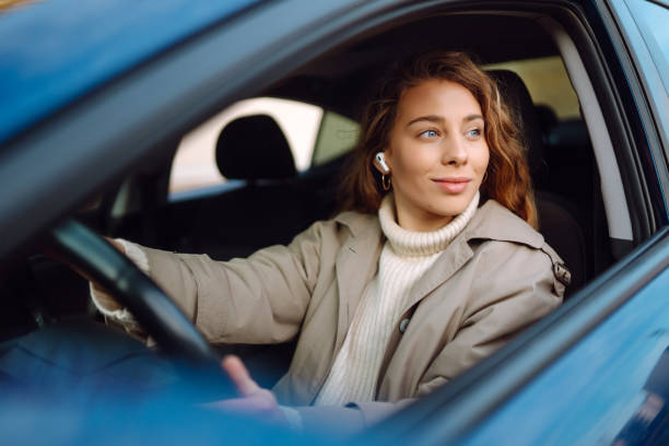 istock Young woman drive a car. 1460288363