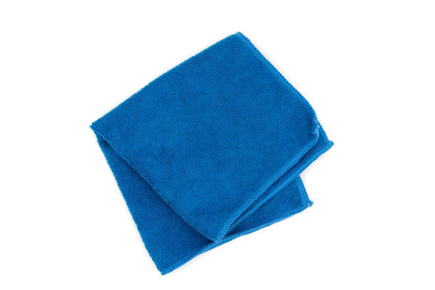 istock Closeup blue duster microfiber cloth for cleaning isolated on white background. Top view. Flat lay 1460288539