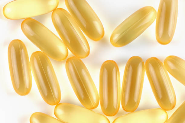 istock Omega 3 gelatin capsules on a white background 1460289306
