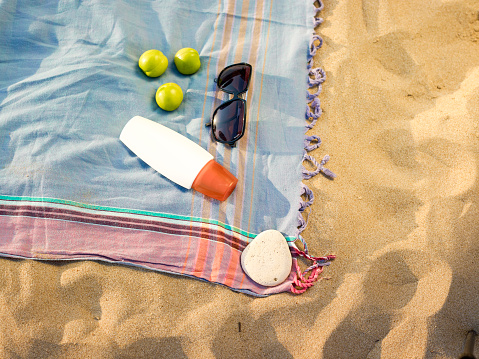 Beach towel and sun glasses