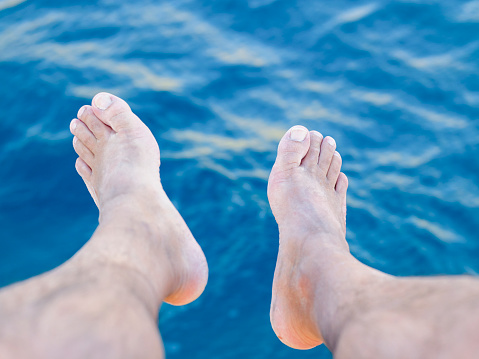 sunburned feet of a woman in summer