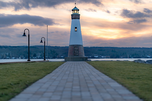 Sunset photo of the Myers Point Lighthouse at Myers Park in Lansing NY, Tompkins County. The lighthouse is situated on the shore of Cayuga Lake, near Ithaca New York.