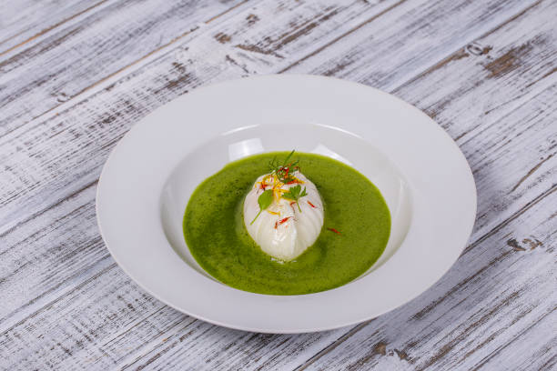 istock Green sauce with poached egg in white plate 1460292312