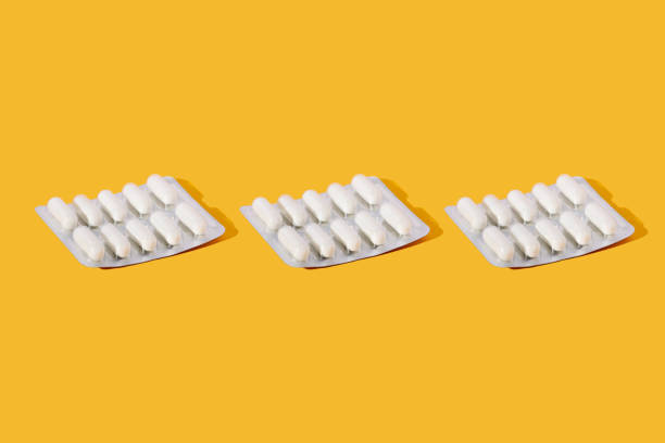 istock blister pack with pills on a yellow background 1460293712