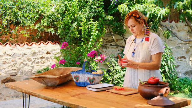 Mediterranean Woman Peeling Tomato