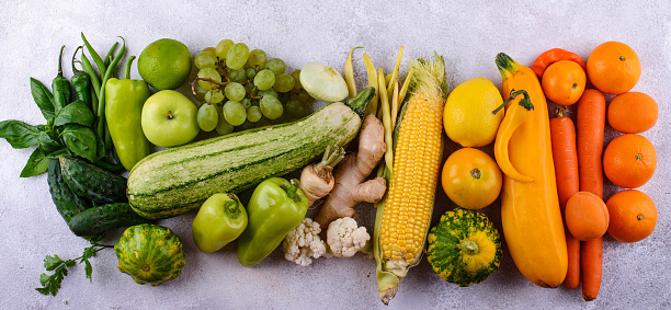 Assortment of red, yellow, green, orange, purple vegetables and fruits. Rainbow food