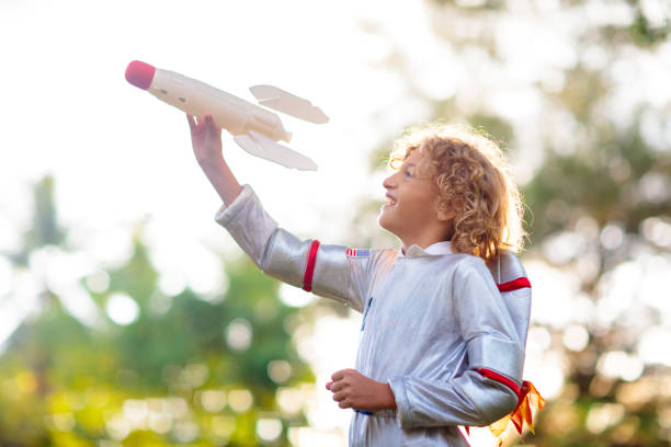 istock Little boy playing with spaceship. Astronaut kid. 1460307811