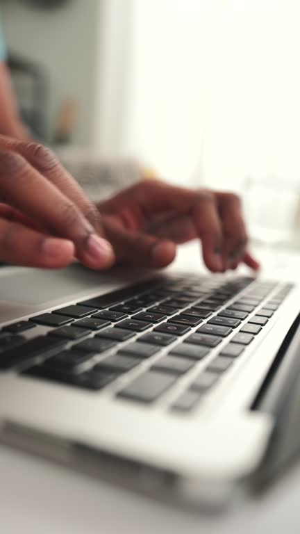 Male using laptop at home.