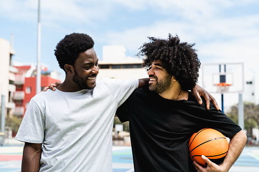 African American friends playing basketball outdoor - Urban sport lifestyle concept